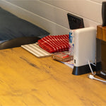 Wooden dining table and workspace with charging point inside a luxury 2 person glamping pod