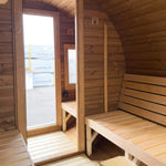 View from the sauna room towards the glass door and separate changing room in the Infinity Glass barrel sauna