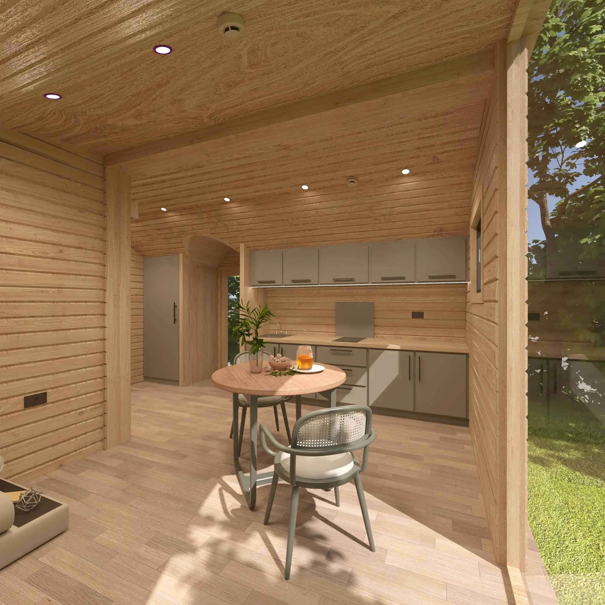 Open-plan interior of the Moonburrow Pod luxury glamping accommodation, showcasing the seamless flow between kitchen, dining, and living areas.