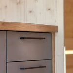 Close-up of the kitchenette drawers inside The Ridgefall Pod, highlighting modern fittings and compact glamping functionality.