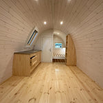 Full interior view of the Twilight Pod showing open-plan layout with kitchen, bathroom, and sleeping area