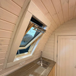 Angled interior view of open VELUX roof window above kitchen area in the Twilight luxury glamping pod