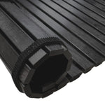 Close-up of black treated alder roll-up wooden floor mat with dark slats and strap