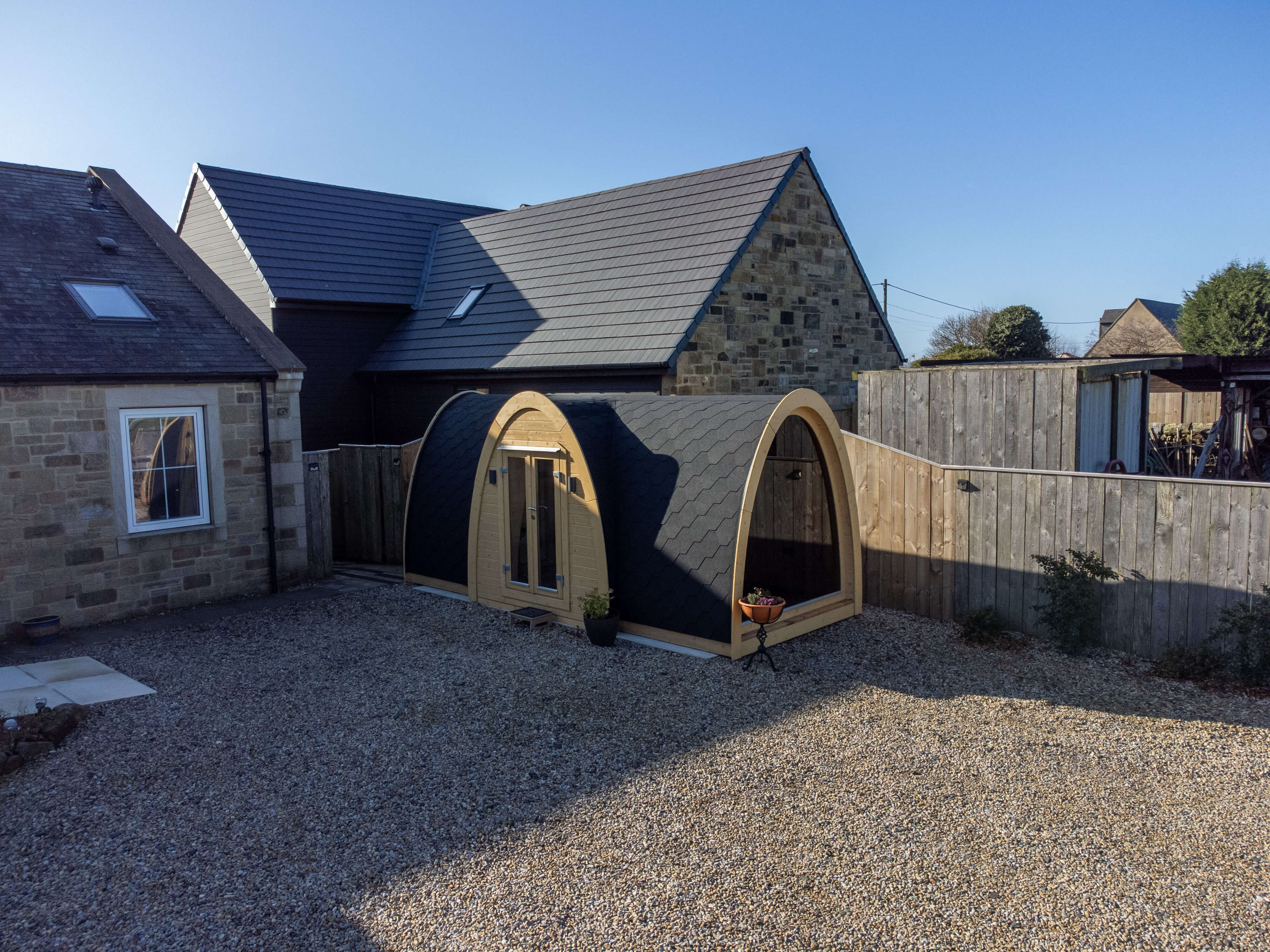 Custom garden office pod installed by GlampLaunch in Northumberland, featuring a bespoke Hobbit-style design created for remote working, productivity, and multi-purpose use.