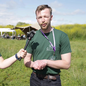 Taylor Glass being interviewed at a glamping industry event while representing the Glamping Industries Trade Association.