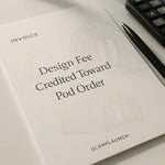 GlampLaunch invoice showing design fee credited toward pod order beside glamping pod line drawings, pen and calculator on white desk under soft daylight.