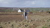 Taylor Glass walking a prospective development site with project drawings, explaining access routes, site planning considerations, and the early stages of creating a future glamping and hospitality development.
